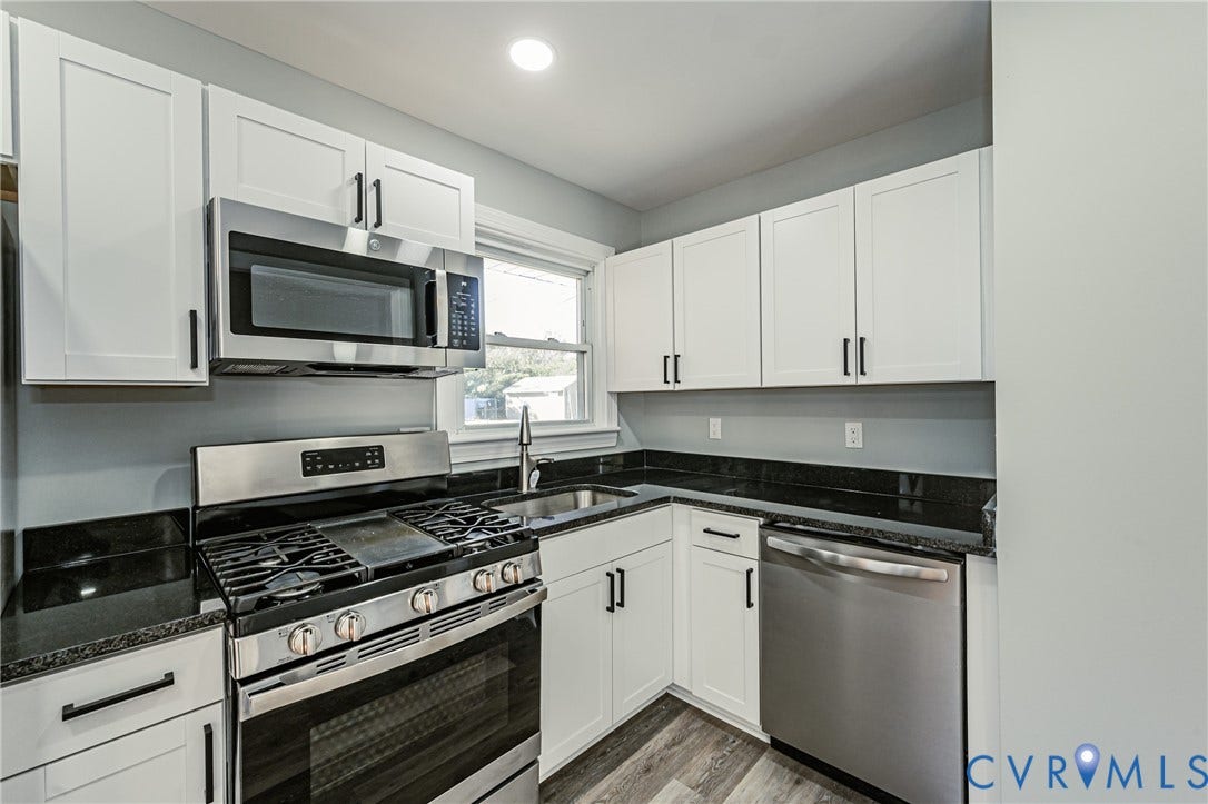 506 Meadowspring Road, Henrico, VA 23223 Kitchen featuring white cabinetry, dark stone countertops, stainless steel appliances, and wood-finish flooring