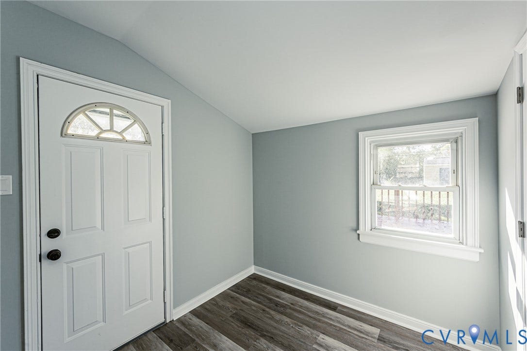 506 Meadowspring Road, Henrico, VA 23223 Interior room featuring wood-finish flooring, vaulted ceilings, and a single-hung window with casing