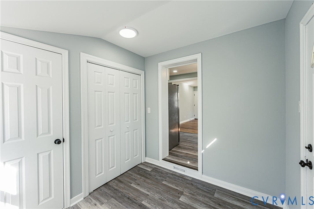 506 Meadowspring Road, Henrico, VA 23223 Interior space featuring wood-finish flooring, double-panel closet doors, and a flush-mount circular ceiling light fixture