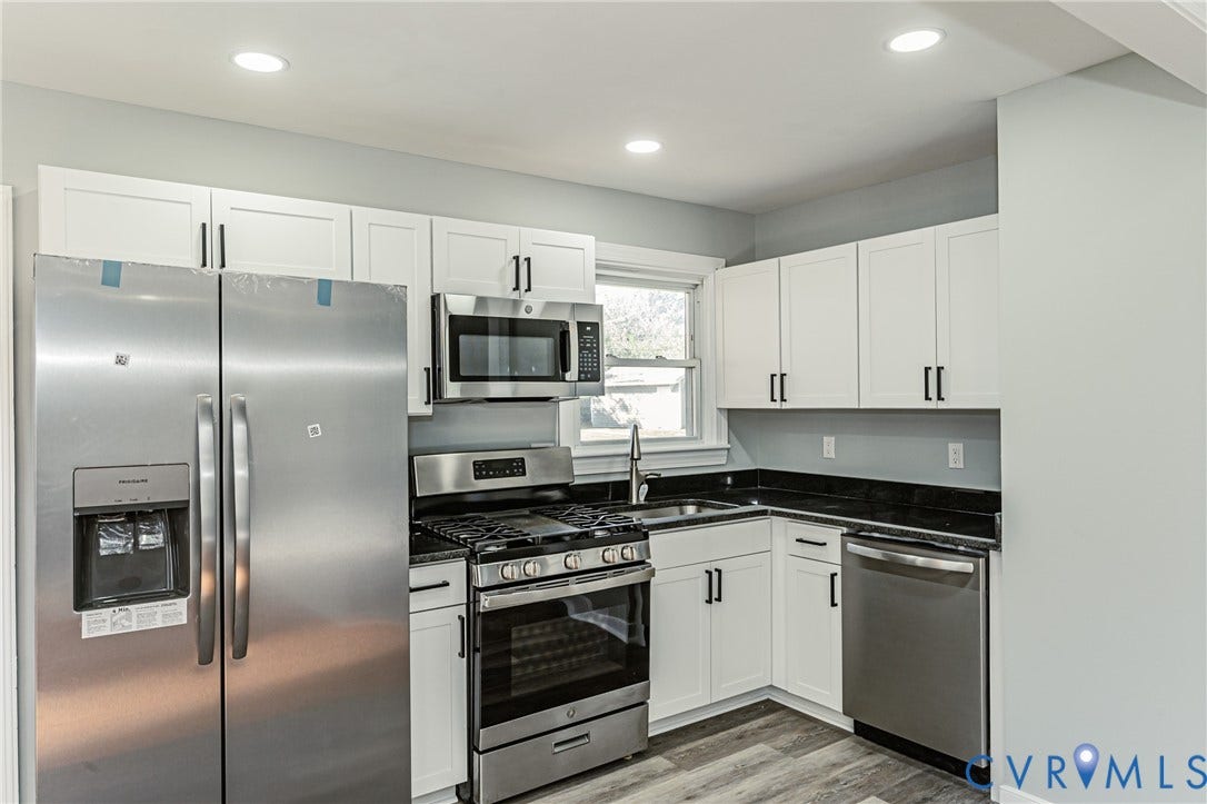 506 Meadowspring Road, Henrico, VA 23223 Kitchen featuring white shaker-style cabinetry, stainless steel appliances, dark stone countertops, recessed lighting, and wood-finish flooring