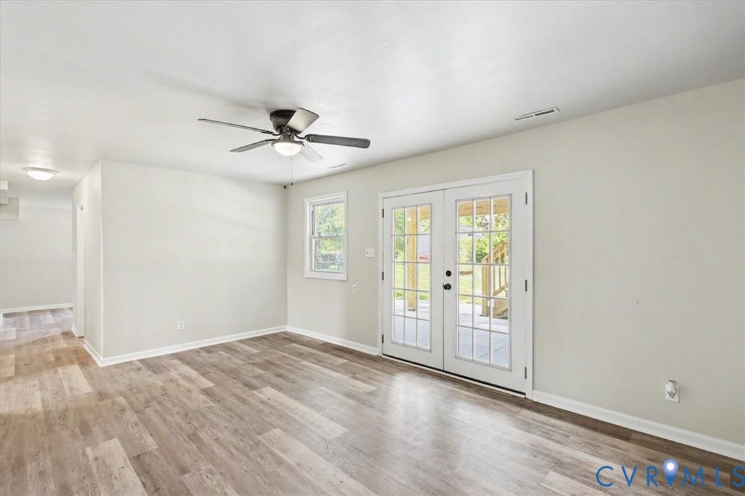 9737 Graves Road, South Chesterfield, VA 23803 Room featuring wood-finish flooring, glass-paned double doors, a ceiling fan with integrated lighting, and neutral wall tones