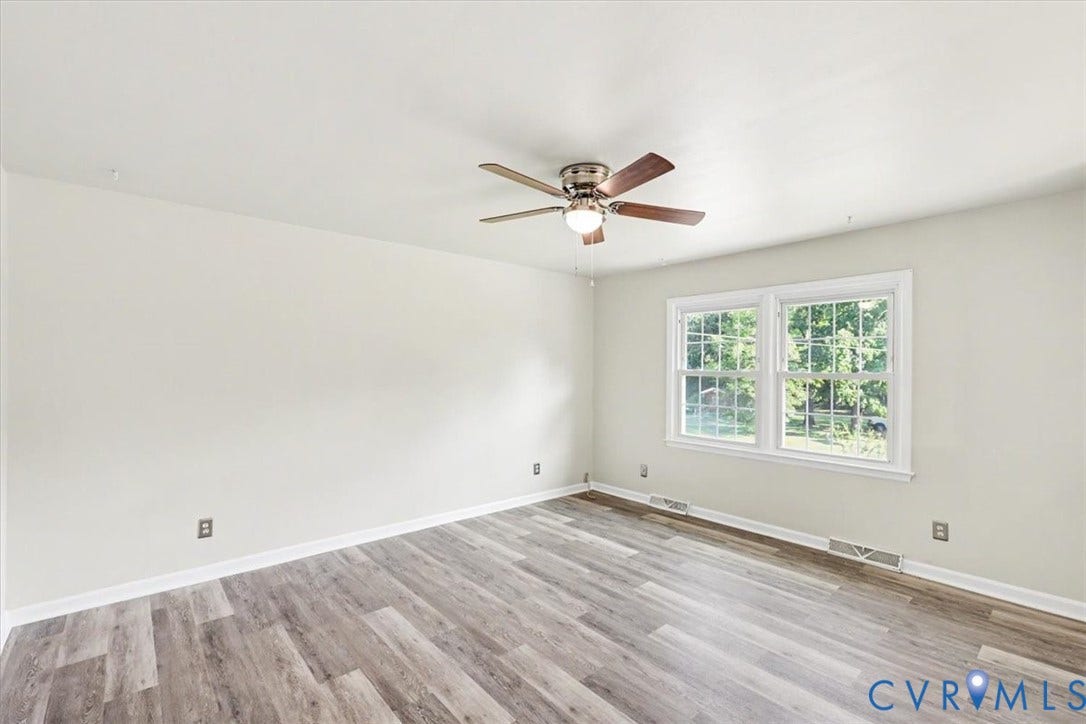 9737 Graves Road, South Chesterfield, VA 23803 Room featuring wood-finish flooring, neutral wall paint, and a ceiling fan with integrated lighting