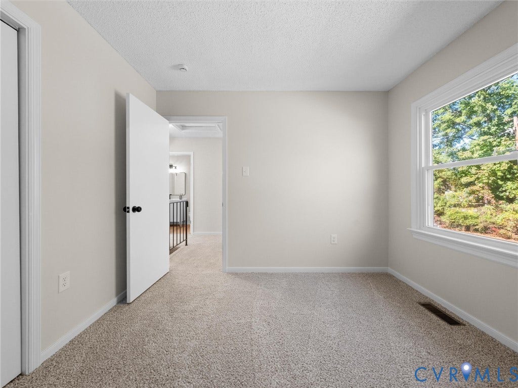 406 Alamosa Drive, Henrico, VA 23075 Neutral interior featuring wall-to-wall carpeting, a multi-pane window, and white interior doors with matte black hardware
