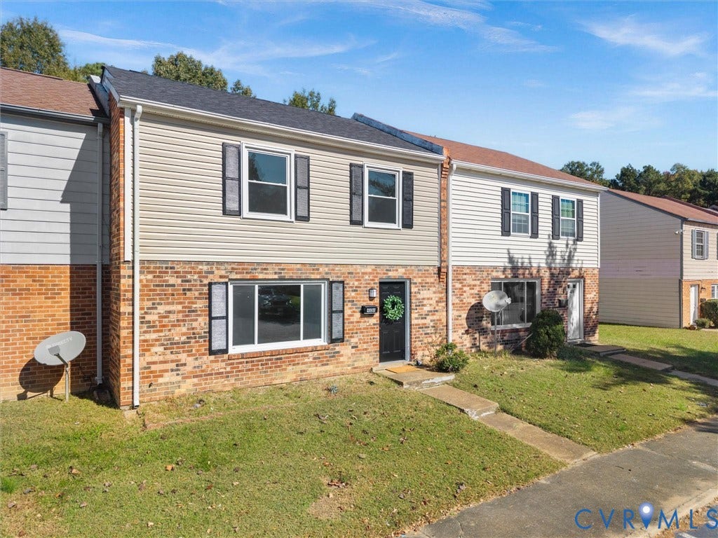 406 Alamosa Drive, Henrico, VA 23075 Two-story residence featuring a brick and horizontal siding exterior, dark-toned shutters, and shingle roofing
