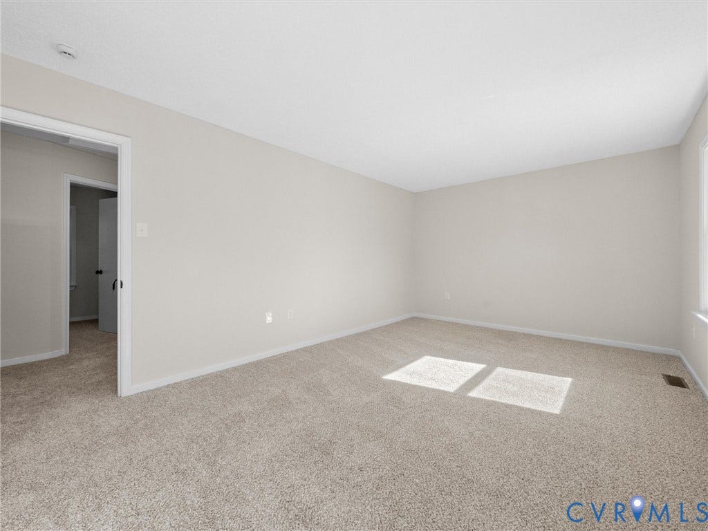 406 Alamosa Drive, Henrico, VA 23075 Neutral-toned interior space featuring light-colored wall paint and wall-to-wall carpeting