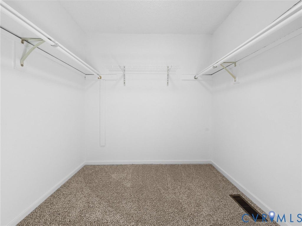 406 Alamosa Drive, Henrico, VA 23075 Walk-in closet featuring neutral carpeting, white walls, and dual-level wire shelving