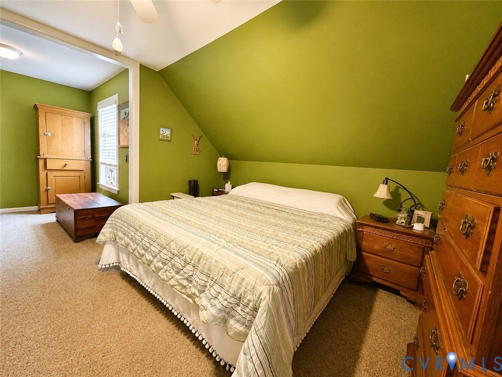 65 Cubbley Road, Hot Springs, VA 24445 Bedroom featuring a vaulted ceiling with a sloped wall, wall-to-wall carpeting, and a multi-pane window