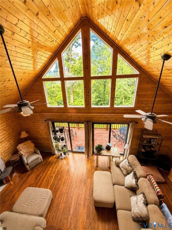65 Cubbley Road, Hot Springs, VA 24445 Vaulted tongue-and-groove wood ceiling, expansive floor-to-ceiling multi-pane window, wood-finish flooring, and dual ceiling fans