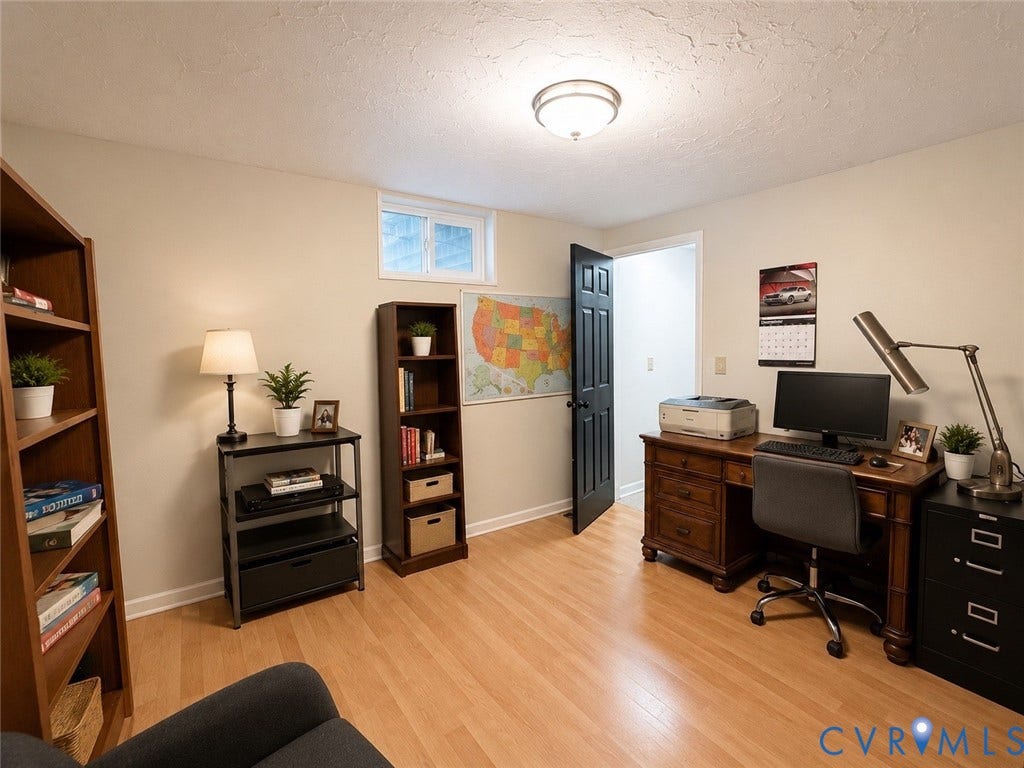 65 Cubbley Road, Hot Springs, VA 24445 Room featuring wood-finish flooring, a recessed window, and a dark-finished interior door with coordinating hardware, illuminated by a ceiling-mounted flush light fixture