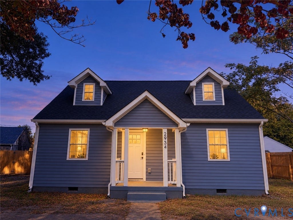 2934 W Strathmore Road, Chesterfield, VA 23237 Cape Cod-style residence featuring horizontal lap siding, a pitched roofline with dual dormers, and a covered front entry porch with white structural columns