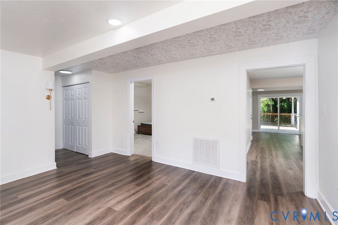 14043 Jefferson Highway, Louisa, VA 23024 Interior space featuring wood-finish flooring, recessed lighting, wall-mounted light fixture, dual-panel closet doors, and patterned ceiling texture