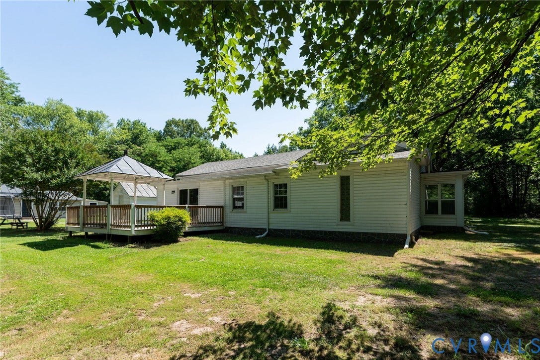 14043 Jefferson Highway, Louisa, VA 23024 Backyard featuring a raised wooden deck with a gazebo, white siding, and mature trees