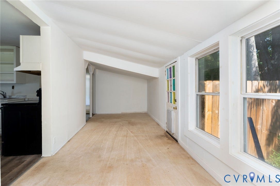 14043 Jefferson Highway, Louisa, VA 23024 Sunroom featuring a vaulted ceiling, oversized windows, and a multi-pane glass door