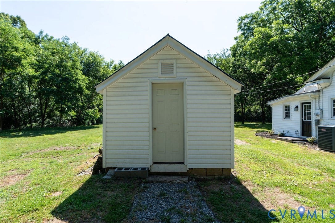 14043 Jefferson Highway, Louisa, VA 23024 Detached storage structure featuring horizontal siding, a gabled roof, and a single-entry door