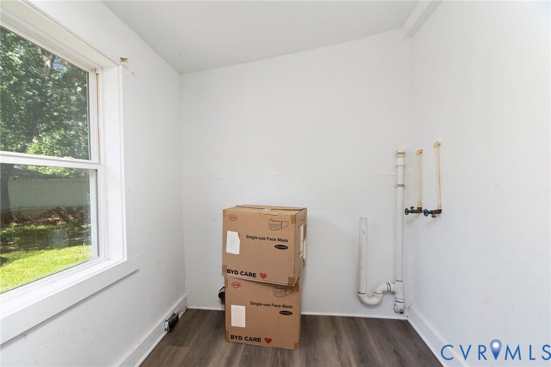 14043 Jefferson Highway, Louisa, VA 23024 Utility space featuring wood-finish flooring, a large window, and plumbing hookups