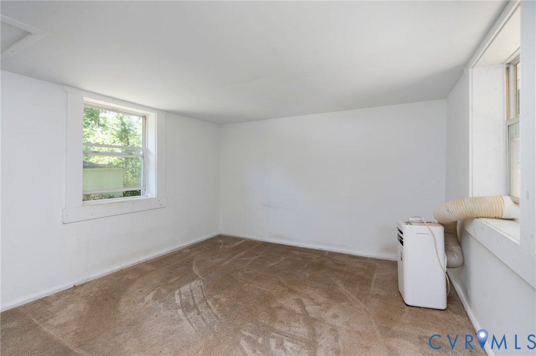 14043 Jefferson Highway, Louisa, VA 23024 Neutral-toned wall-to-wall carpeting, white walls, and two double-hung windows