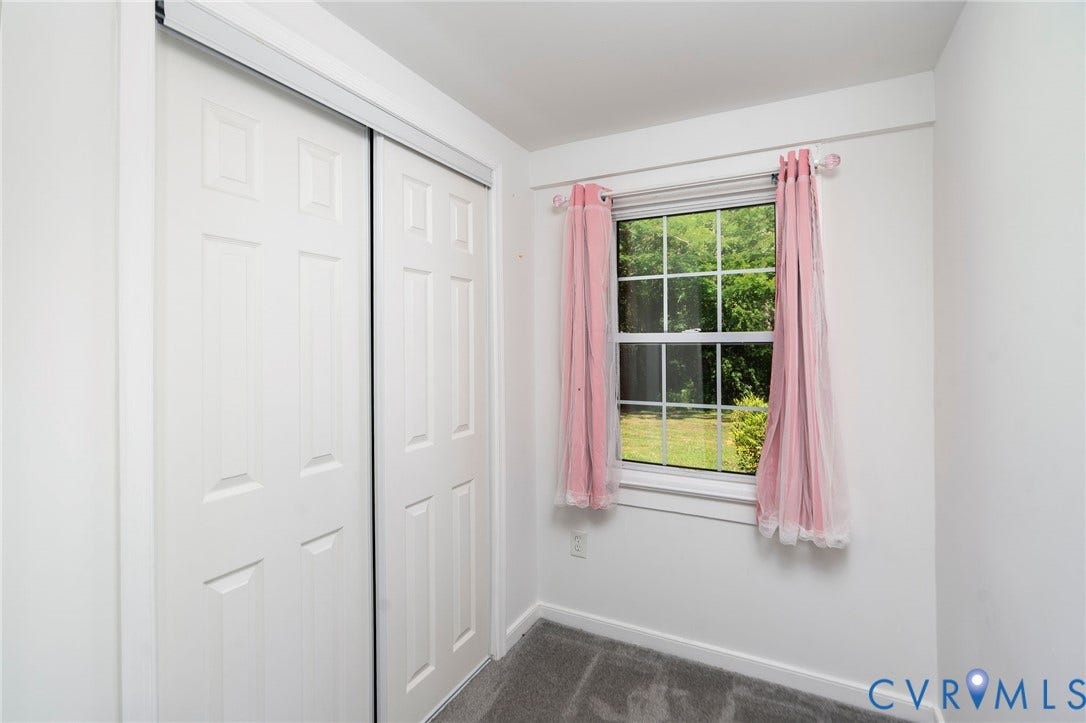 14043 Jefferson Highway, Louisa, VA 23024 Room featuring sliding closet doors, wall-to-wall carpeting, and a multi-pane window
