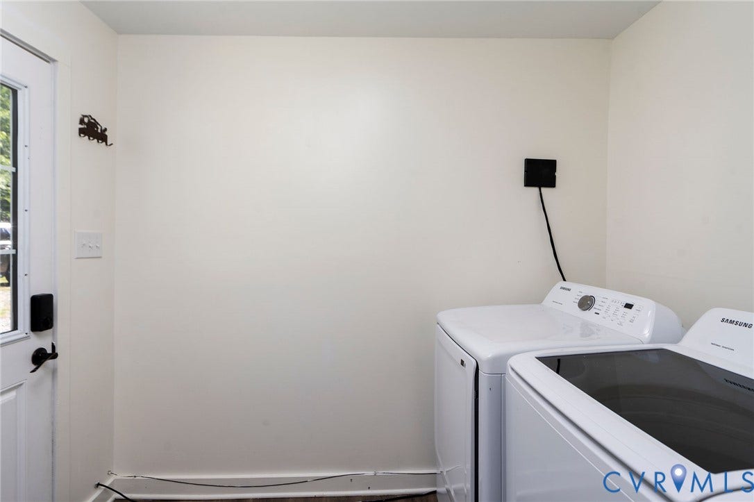 14043 Jefferson Highway, Louisa, VA 23024 Utility area featuring a side-exit door with a glass pane, wood-finish flooring, and built-in laundry appliance connections