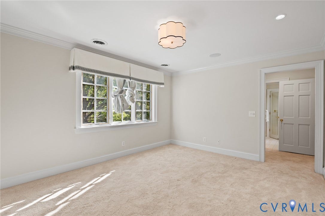 11429 Barrington Bridge Court, Henrico, VA 23233 Multi-pane window with detailed molding, crown molding, scalloped flush-mount lighting fixture, neutral wall-to-wall carpeting, and six-panel interior door