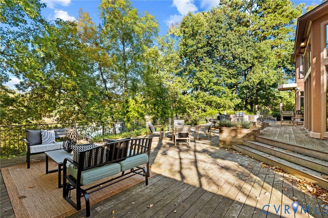 11429 Barrington Bridge Court, Henrico, VA 23233 Multi-level wood deck featuring tiered stairs, built-in planter boxes, and perimeter metal railing