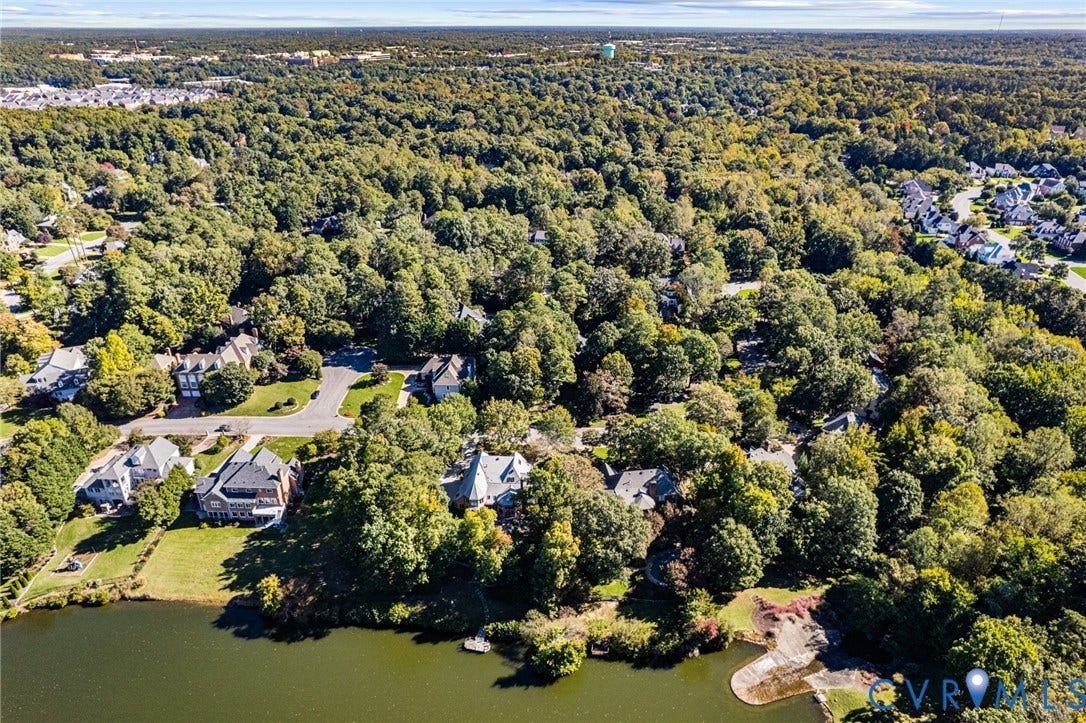 11429 Barrington Bridge Court, Henrico, VA 23233 Aerial perspective of waterfront properties featuring extensive mature canopy, paved cul-de-sac streets, and direct shoreline access