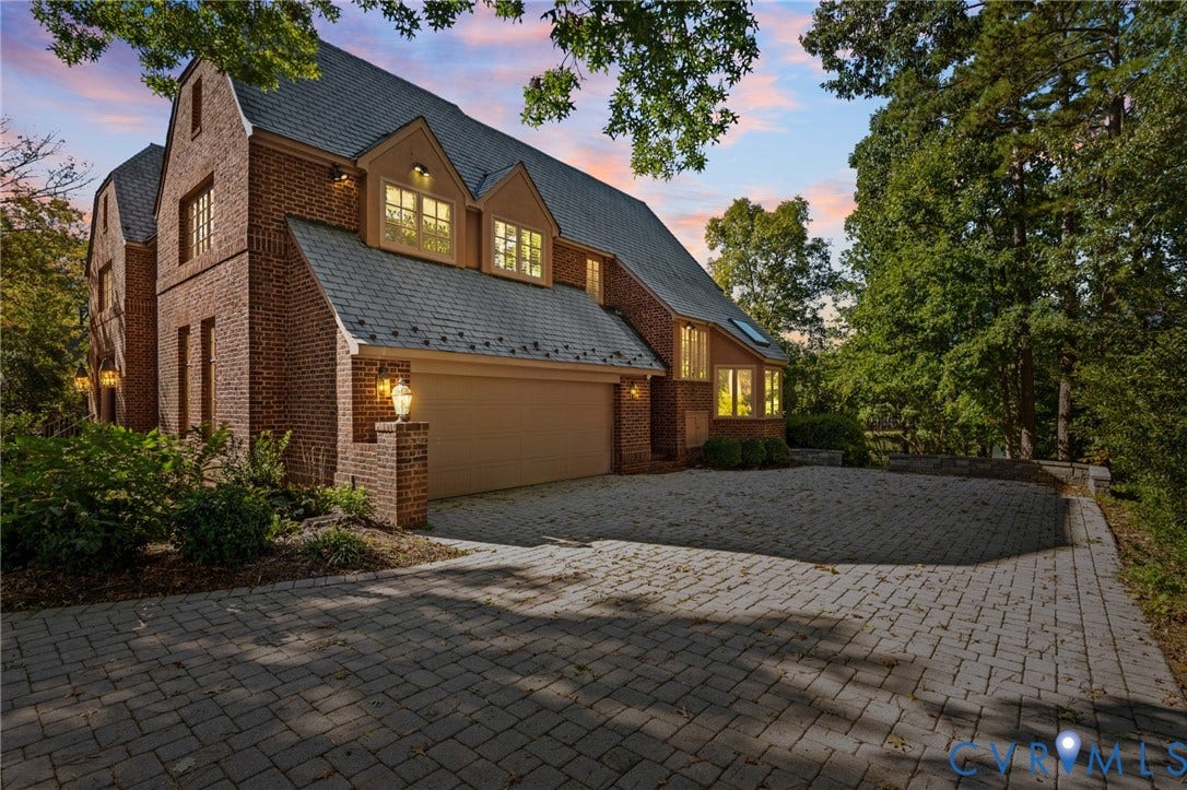 11429 Barrington Bridge Court, Henrico, VA 23233 Multi-story brick exterior featuring a multi-gabled roofline, dormer windows, and a paved stone driveway