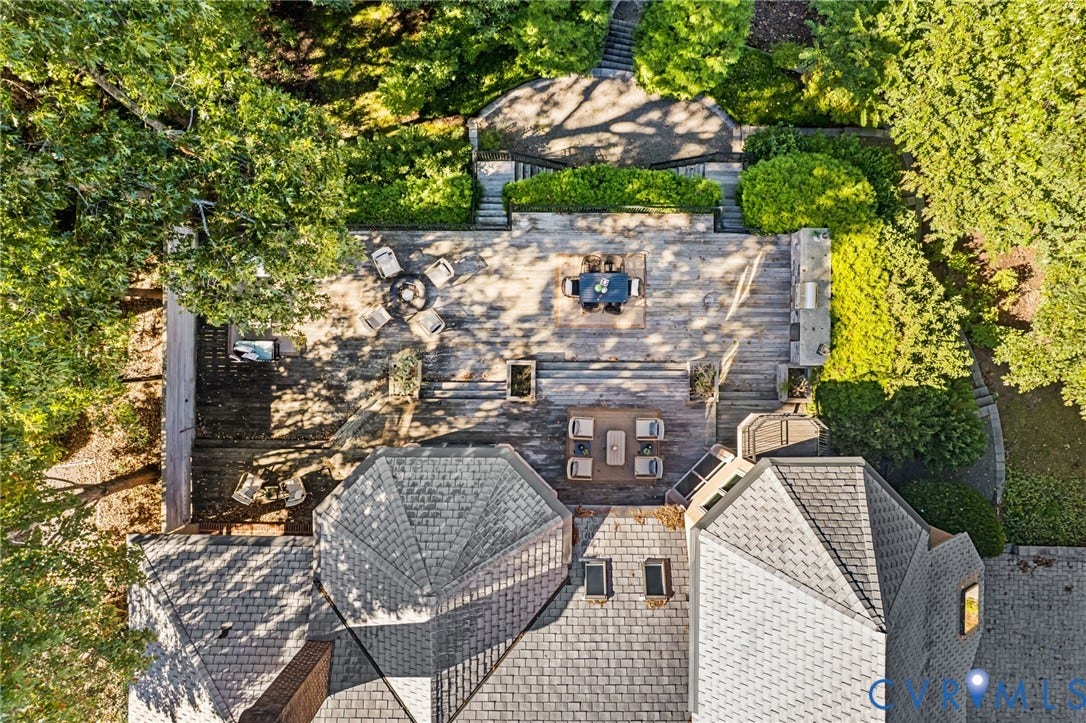 11429 Barrington Bridge Court, Henrico, VA 23233 Multi-level wood deck featuring a built-in outdoor kitchen, stone hardscaping, tiered stairways, and mature landscaping