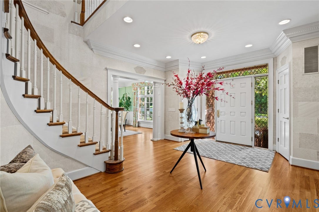 11429 Barrington Bridge Court, Henrico, VA 23233 Foyer featuring curved staircase with wood handrail, hardwood flooring, crown molding, recessed lighting, and front door with leaded glass sidelights