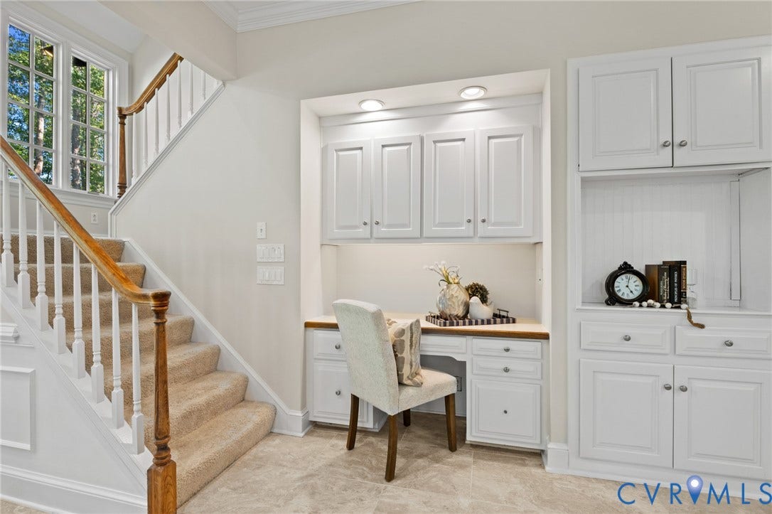 11429 Barrington Bridge Court, Henrico, VA 23233 Built-in white cabinetry featuring recessed-panel doors, solid surface desk workspace, integrated recessed lighting, and staircase with wood handrail