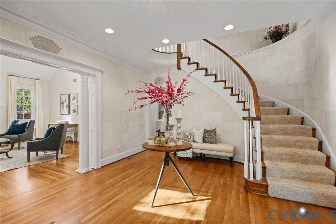 11429 Barrington Bridge Court, Henrico, VA 23233 Foyer featuring curved staircase with wood handrail, white balusters, wood-finish flooring, recessed lighting, and crown molding