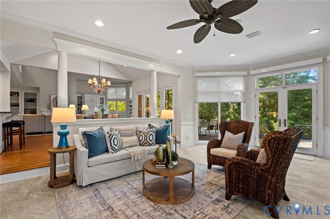 11429 Barrington Bridge Court, Henrico, VA 23233 Open concept living area featuring tray ceilings, recessed lighting, architectural columns, tile flooring, and glass-paned double doors