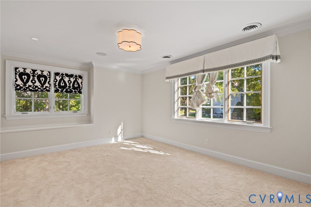 11429 Barrington Bridge Court, Henrico, VA 23233 Neutral-toned interior featuring multi-pane windows, crown molding, wall-to-wall carpeting, and a flush-mount scalloped light fixture
