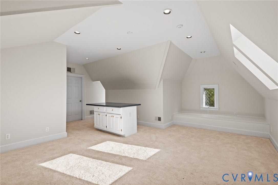 11429 Barrington Bridge Court, Henrico, VA 23233 Vaulted ceiling with recessed lighting, skylights, built-in lower cabinetry with a stone countertop, and custom recessed window seating