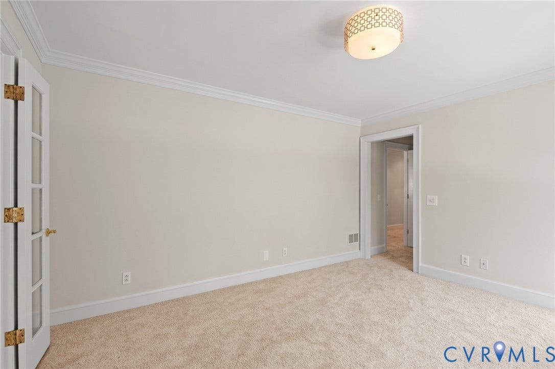 11429 Barrington Bridge Court, Henrico, VA 23233 Neutral-toned room featuring crown molding, carpeting, a decorative flush-mount ceiling light fixture, and a French door with glass paneling