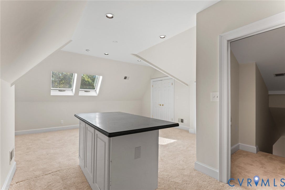 11429 Barrington Bridge Court, Henrico, VA 23233 Vaulted ceiling with recessed lighting, skylights, central island with dark countertop, and built-in closet storage