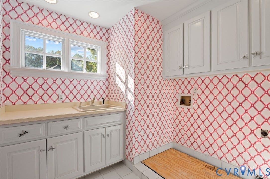11429 Barrington Bridge Court, Henrico, VA 23233 Utility room featuring white shaker-style cabinetry, a built-in drop-in sink with a solid surface countertop, recessed ceiling lighting, and a multi-pane window