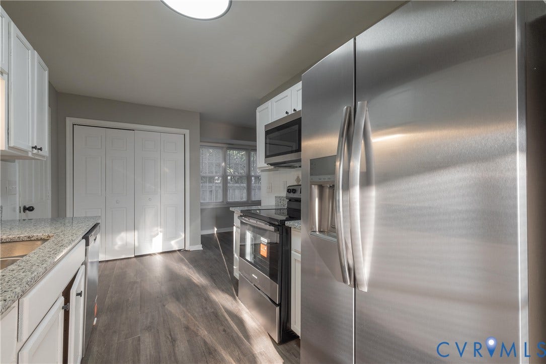 7009 Summers Trace Court, Chesterfield, VA 23832 Kitchen featuring stainless steel appliances, granite countertops, white shaker-style cabinetry, and pantry