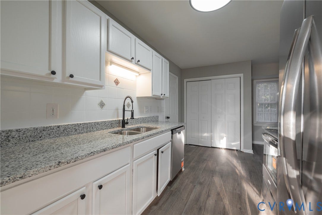 7009 Summers Trace Court, Chesterfield, VA 23832 Kitchen featuring white cabinetry, granite countertops, stainless steel appliances, a high-arc faucet, and wood-finish flooring