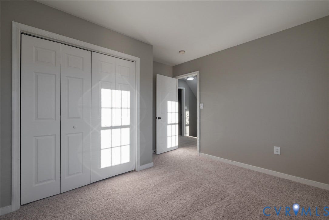 7009 Summers Trace Court, Chesterfield, VA 23832 Bedroom #3 with neutral interior with wall-to-wall carpeting, bi-fold closet doors featuring a multi-pane design, and a solid-core interior door