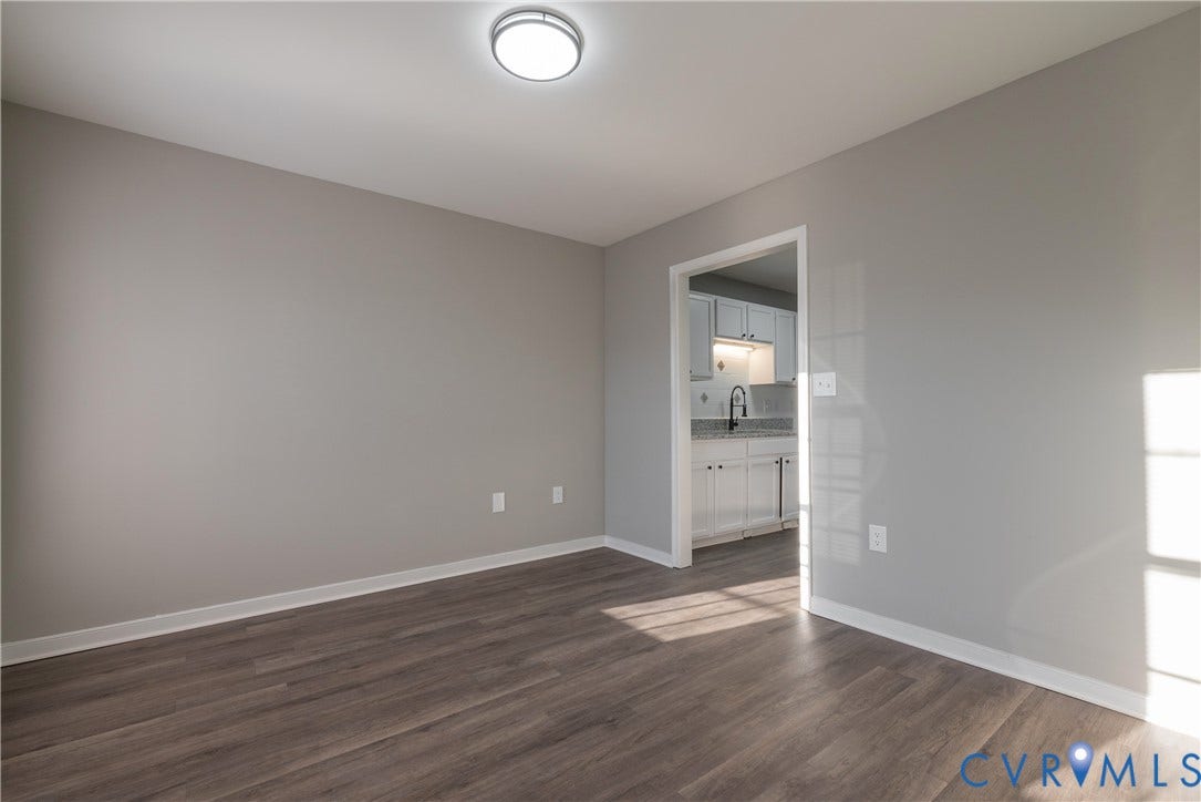 7009 Summers Trace Court, Chesterfield, VA 23832 Formal Dining Room with new flooring, a contemporary flush-mount ceiling light fixture, and white trim