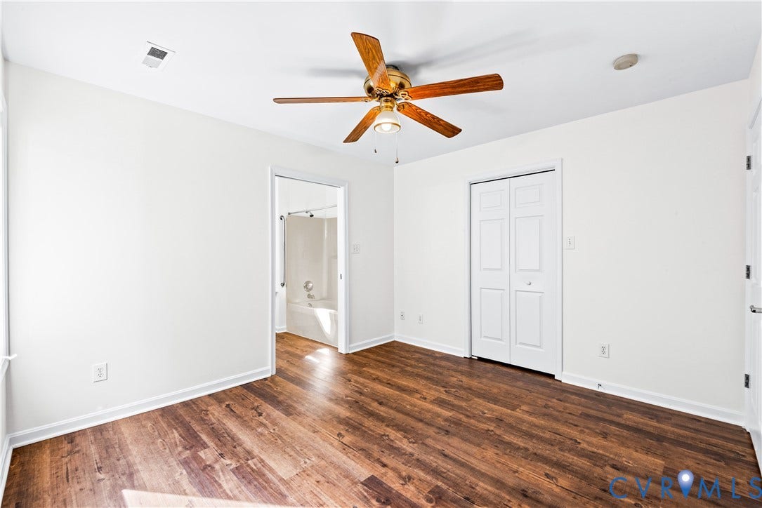 20040 Paradise Lane, Ruther Glen, VA 22546 Wood-finish flooring, ceiling fan with integrated lighting, and bifold closet doors