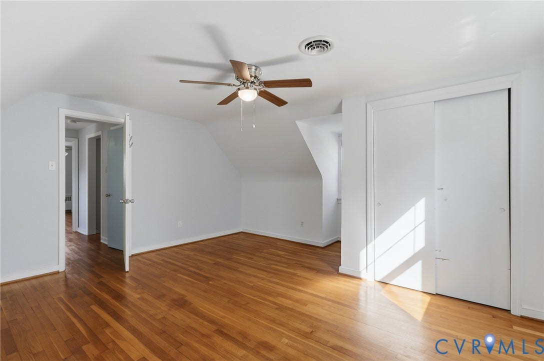 5028 Devonshire Road, Richmond, VA 23225 Hardwood flooring, ceiling fan with light fixture, and dual-panel sliding closet doors