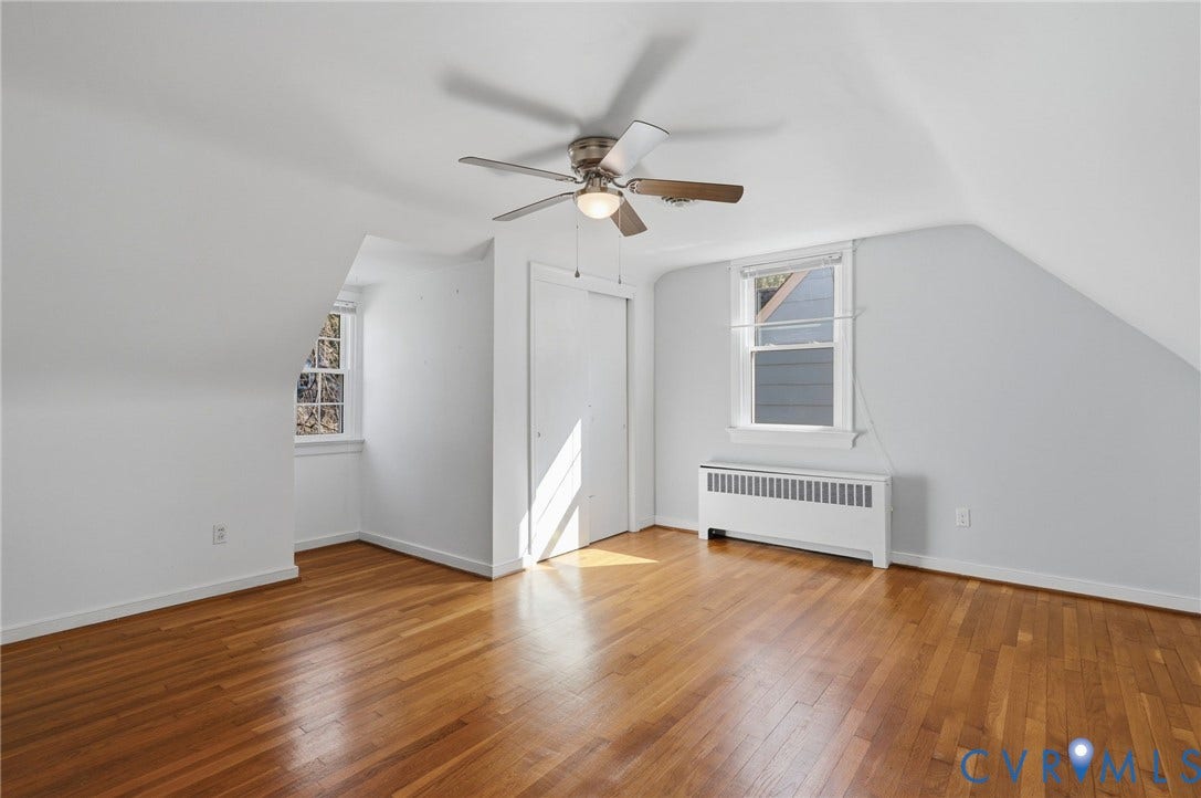 5028 Devonshire Road, Richmond, VA 23225 Room featuring wood-finish flooring, vaulted ceilings, dual-pane windows, and a ceiling fan with integrated lighting
