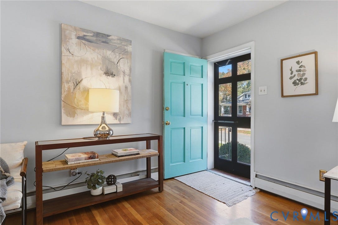 5028 Devonshire Road, Richmond, VA 23225 Entryway featuring light-toned interior walls, natural wood-finish flooring, and a multi-panel door with integrated glass panes