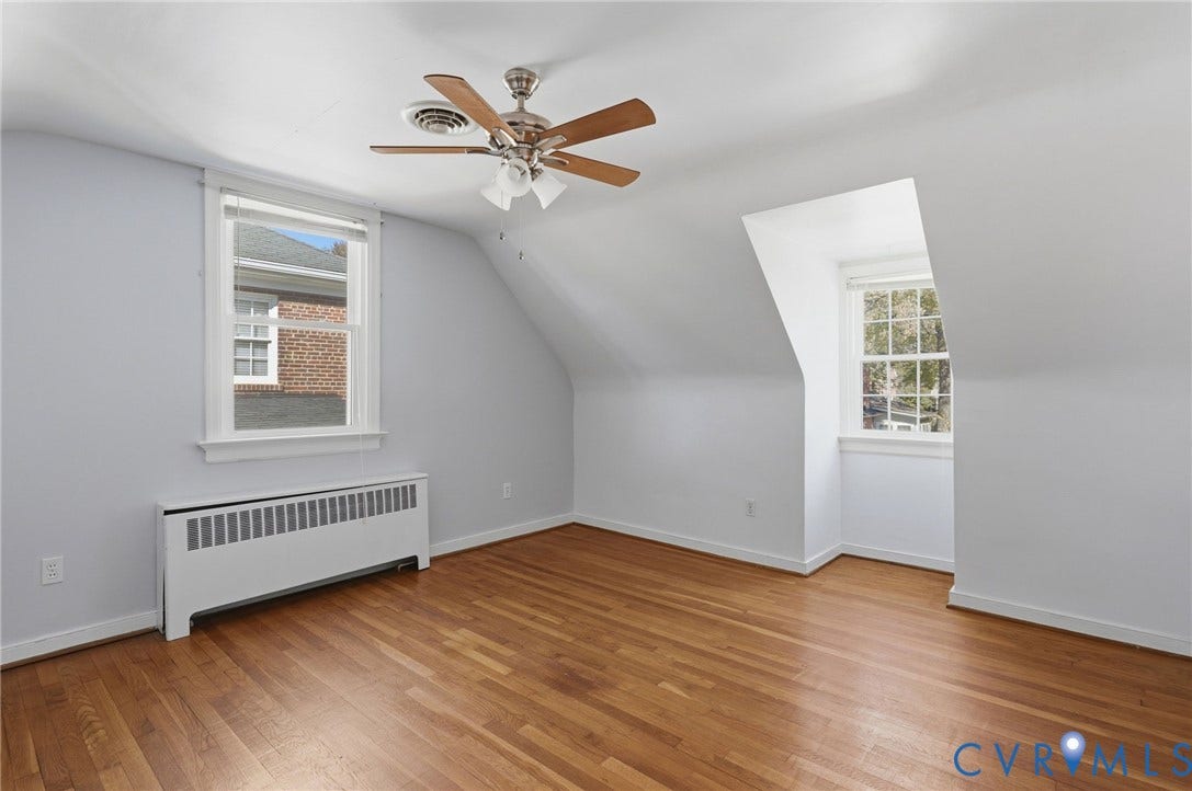 5028 Devonshire Road, Richmond, VA 23225 Room featuring wood-finish flooring, dual dormer windows, and a ceiling fan with integrated lighting