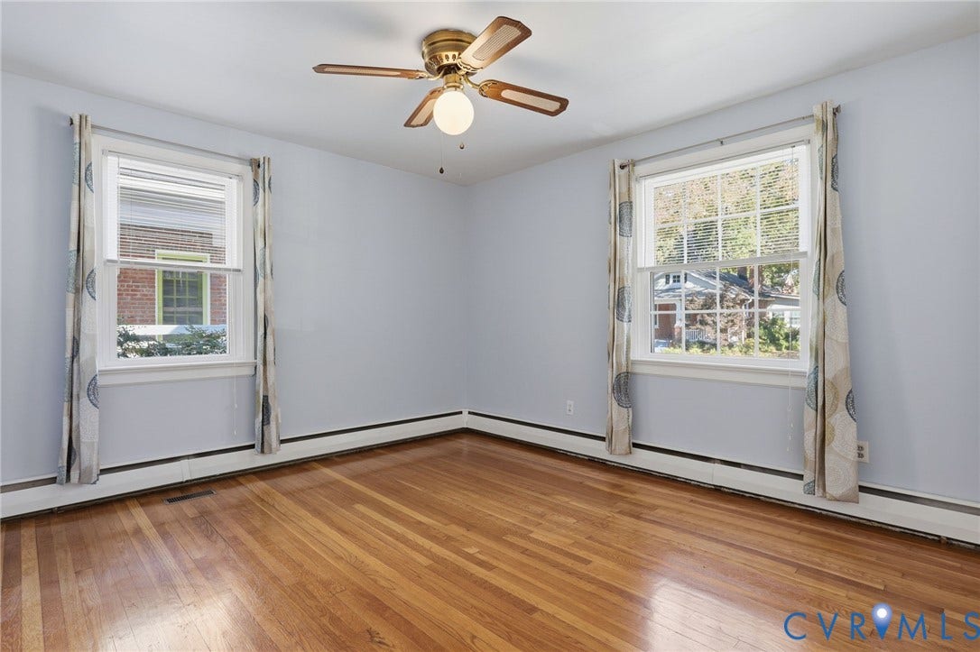5028 Devonshire Road, Richmond, VA 23225 Hardwood flooring, dual multi-pane windows, and a central ceiling fan with integrated lighting