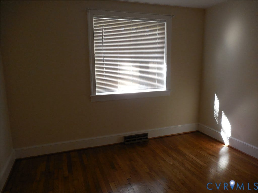 25 Bethany Church Road, Bumpass, VA 23024 Hardwood flooring and a central window with classic casing