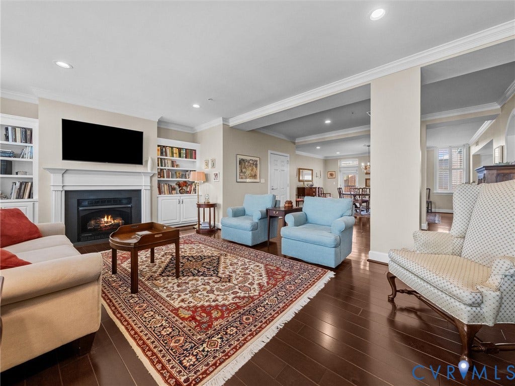 413 Stuart Circle, #3B, Historic Fan District, Richmond, VA 23220 Living room with gas fireplace with mantel and flanking bookcases.