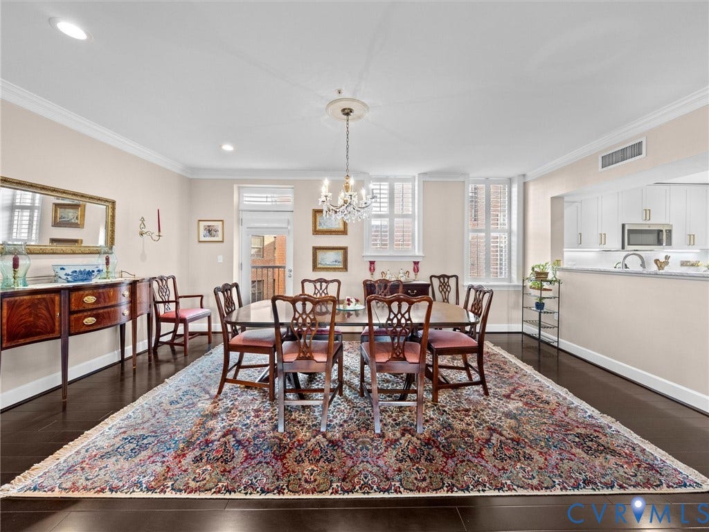 413 Stuart Circle, #3B, Historic Fan District, Richmond, VA 23220 View of dining room which is open to kitchen. Door opens to a Juliet balcony overlooking the historic central courtyard.