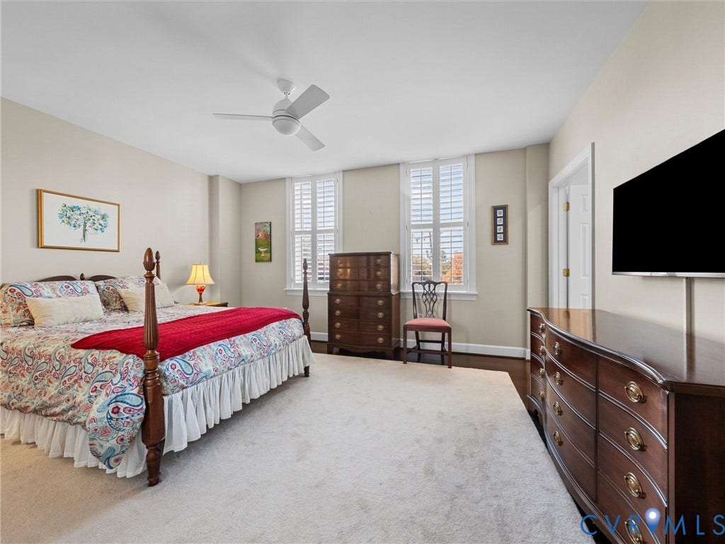 413 Stuart Circle, #3B, Historic Fan District, Richmond, VA 23220 Spacious primary bedroom with multiple windows with plantation shutters.